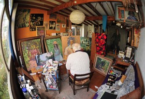 Painter painting in his studio artist
